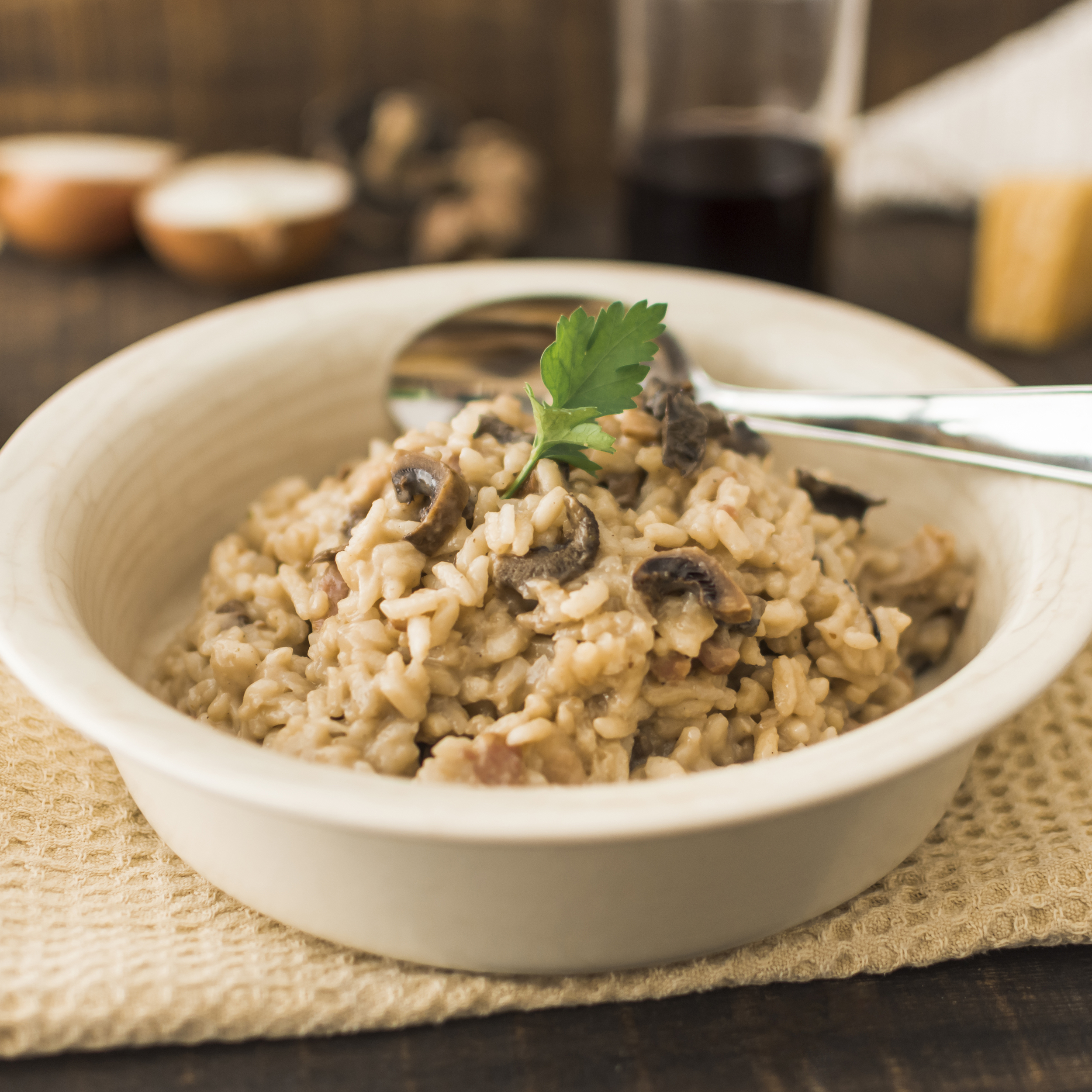 delicious mushroom risotto white bowl with spoon